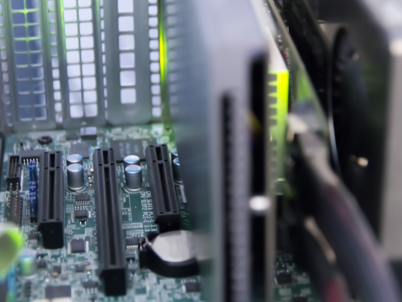 Close-up of dense computer hardware components, representing multiple enterprise systems whose records AI agents reconcile inside a private, on-premises environment