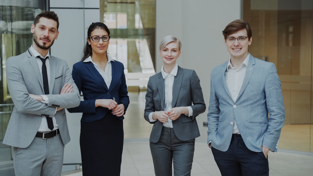A group of banking operations professionals standing together, representing the payment investigation teams whose exceptions and investigations casework is supported by on-premises AI agents inside the bank's own security boundary
