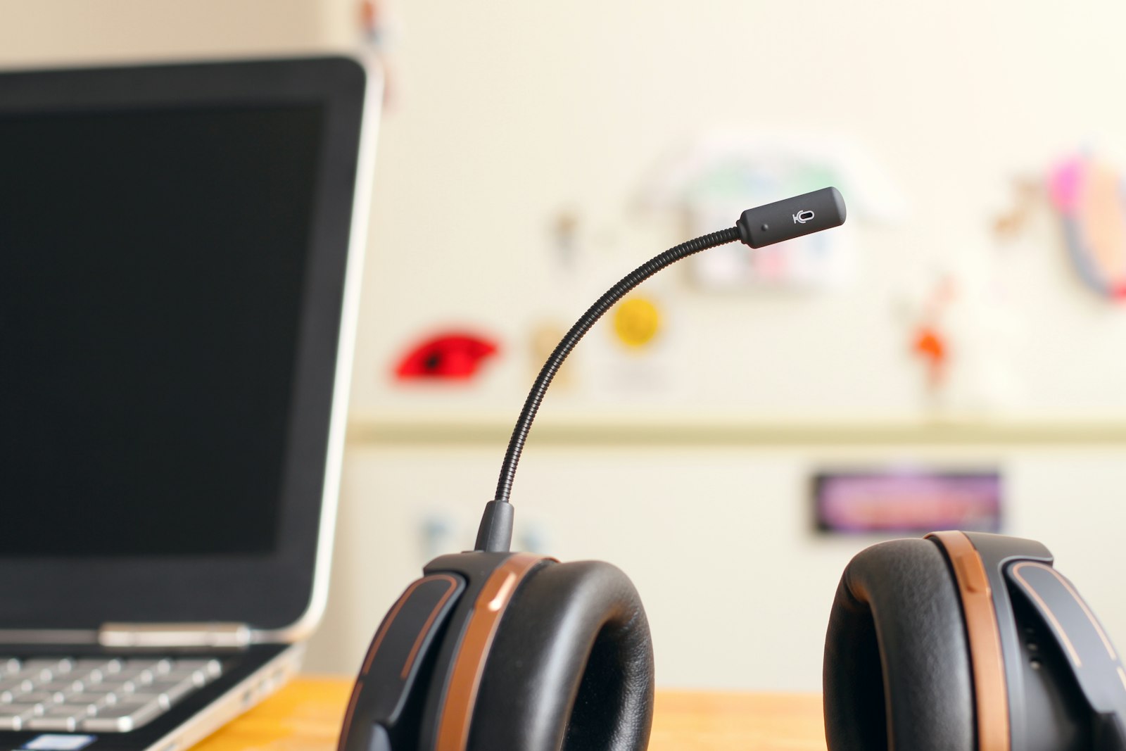 A headset beside a laptop on a customer service desk, representing the regulated complaints handling teams supported by governed on-premises AI agents
