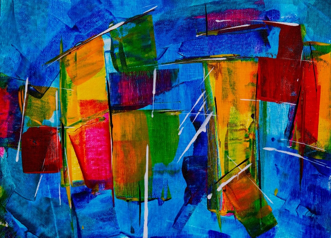 A vivid abstract painting in red, yellow, green and blue brush strokes, representing pictures made with locally run image generation models