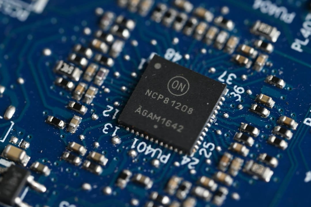 Close-up of a small controller chip surrounded by surface-mount components on a blue circuit board, a reminder that small language models are sized for modest hardware