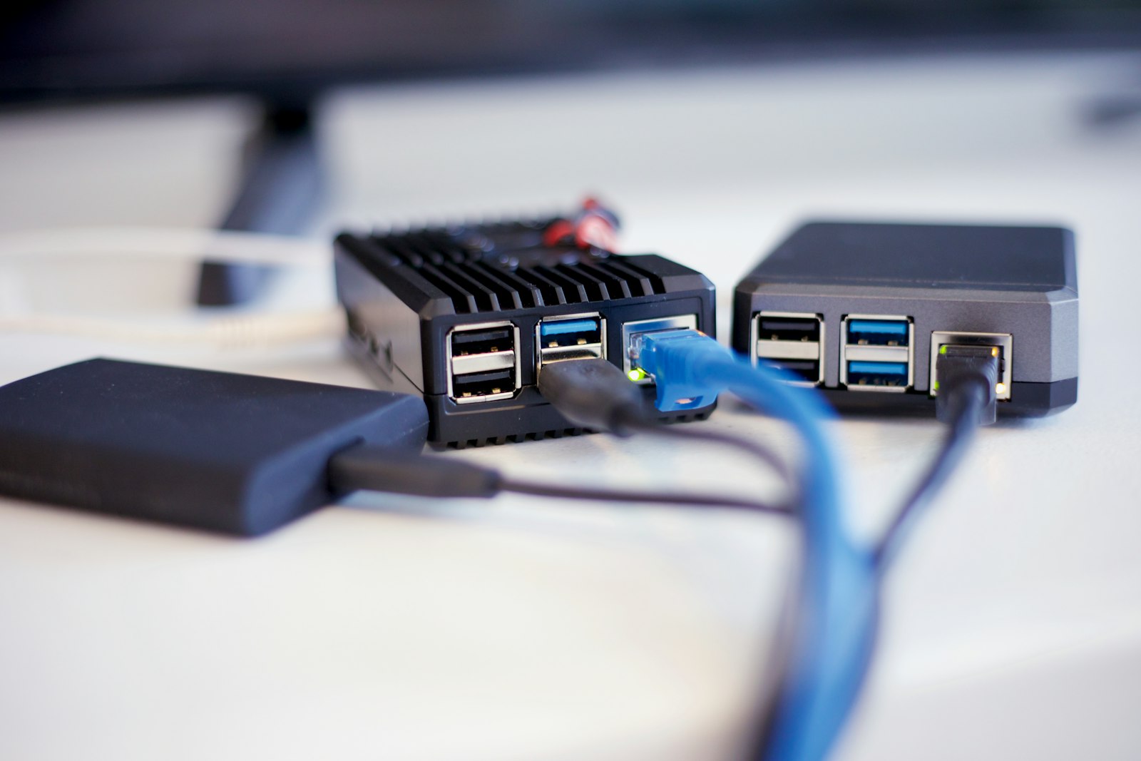 Close-up of blue and black network cables connected to hardware, representing the governed API and system integrations that let on-premises VDF AI agents reach internal enterprise systems inside the organization's own security boundary