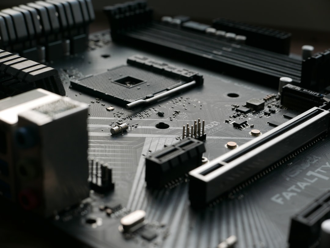 Close-up of a motherboard with many components, representing the layers of custom engineering an enterprise takes on when it builds an AI agent platform from open-source frameworks instead of adopting a governed on-premises platform