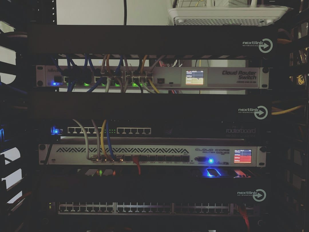 Rack-mounted network appliances with status lights and patch cables in a dark equipment cabinet, standing in for the gateway that sits between AI agents and the tool servers they call