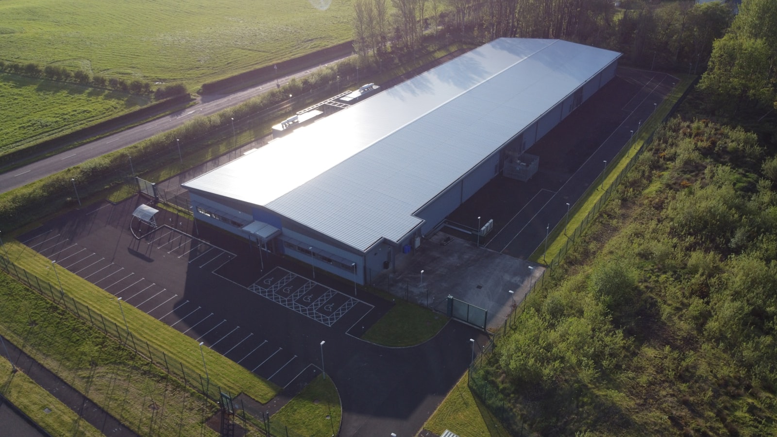 Aerial view of a large enterprise data center building, representing the on-premises infrastructure where a private AI agent platform runs inside the organization's own security boundary rather than in a shared cloud tenant