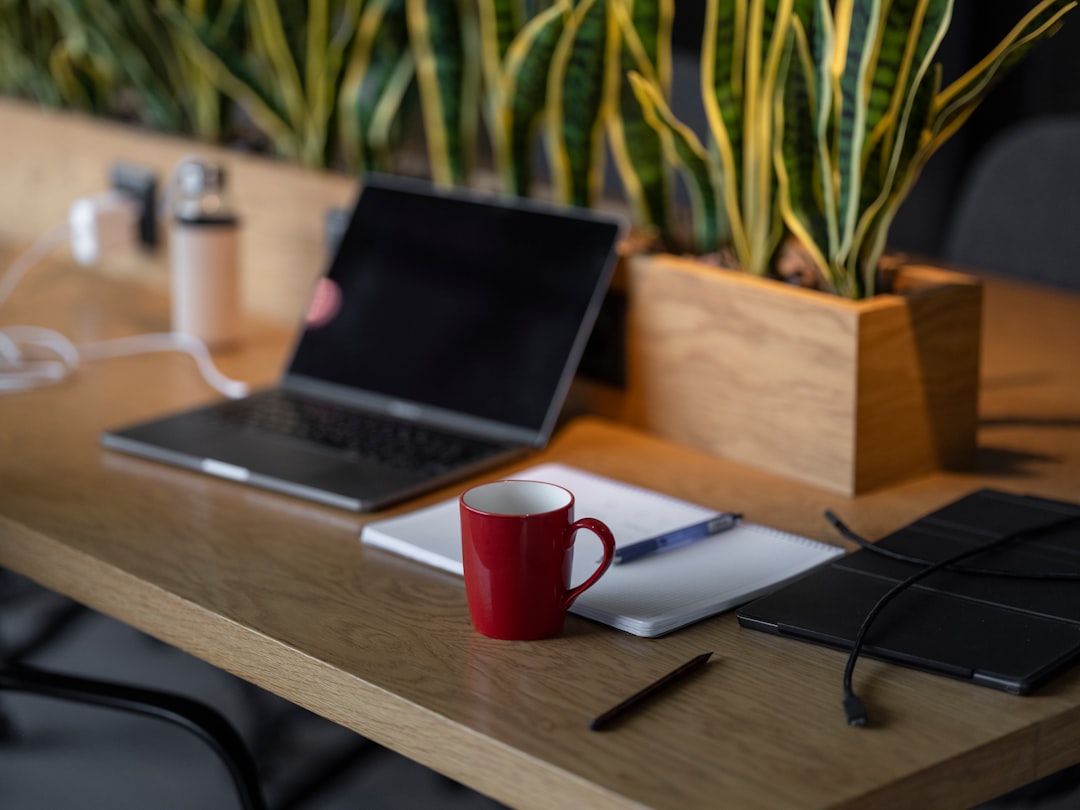 Laptop on an empty desk representing the AI platform access, agents, and retrieval permissions left behind when an employee leaves