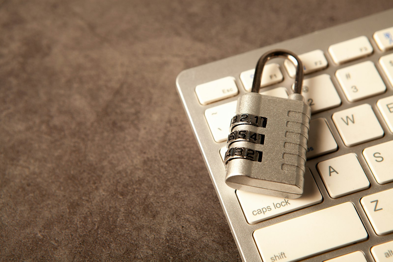 Padlock resting on a computer keyboard, representing security controls for the on-premises AI data plane of prompts, embeddings, logs, and agent outputs