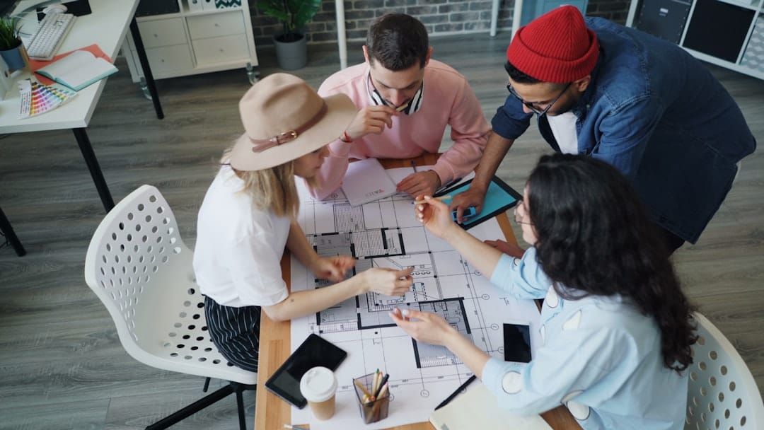 Enterprise team collaborating around a table in a business meeting