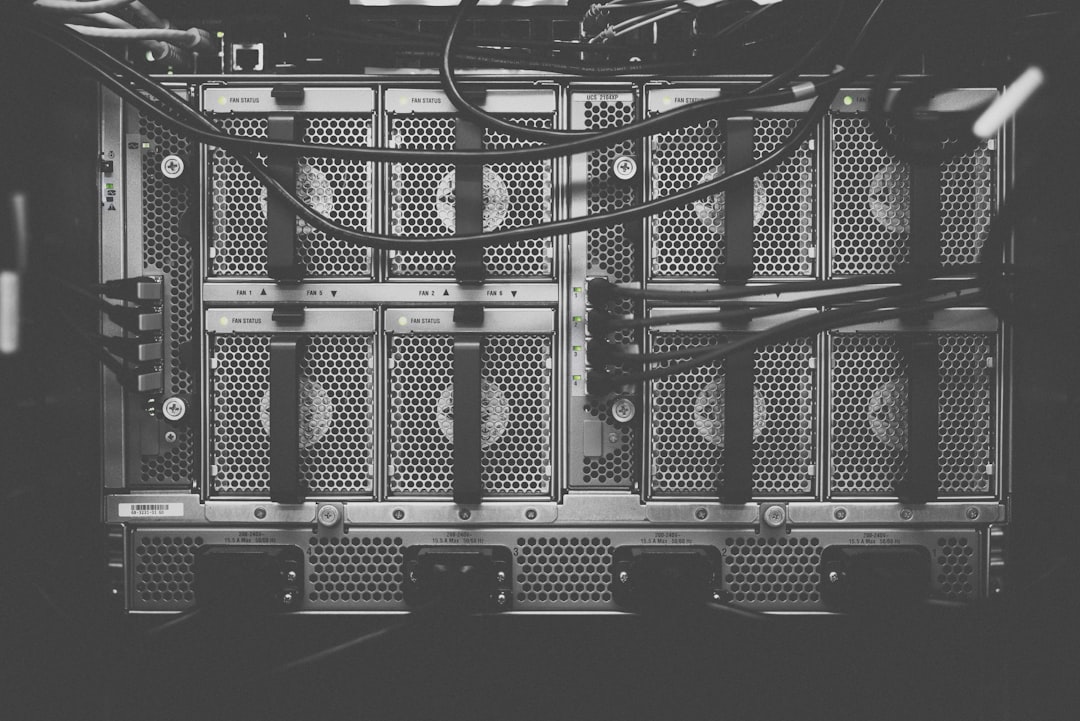 Server blades and cabling in a rack representing portable, vendor-neutral AI agent platform infrastructure