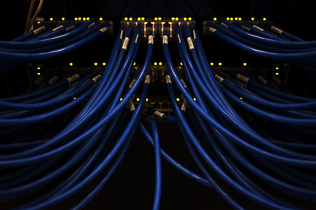 Structured blue network cabling in a server rack representing enterprise AI agent platform architecture patterns