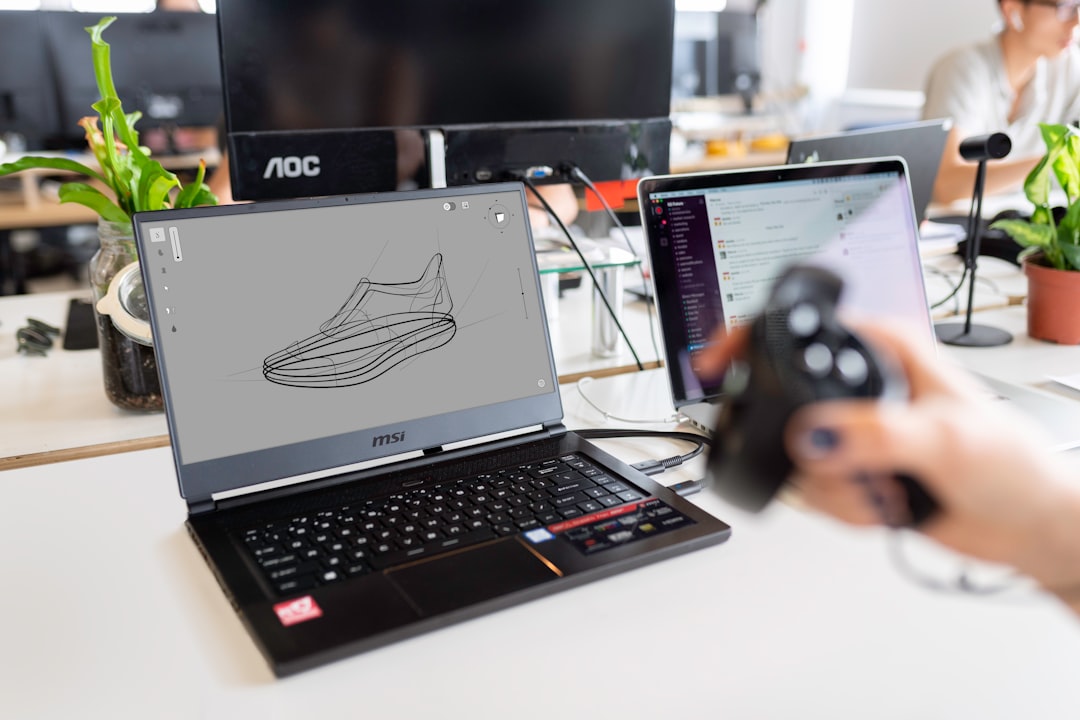 Engineer working at a laptop in a modern workspace, representing the practical deployment considerations behind enterprise AI assistant selection