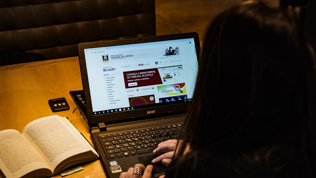 Person working on a laptop in a secure office environment, representing how law firms and legal departments are deploying private on-premise AI while maintaining client confidentiality and data protection