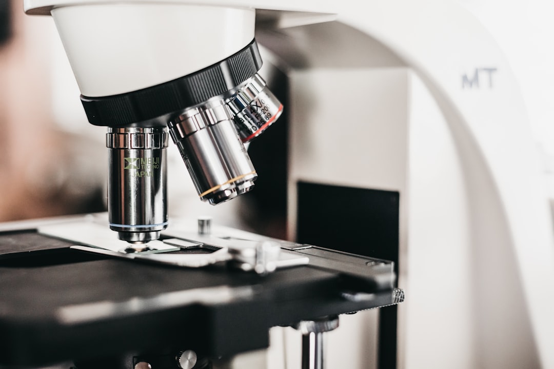 Laboratory researcher working with advanced analytical equipment in a secure pharmaceutical research environment, representing on-premise AI deployment for drug discovery and regulated clinical workflows
